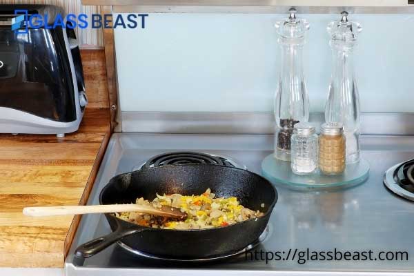 how to protect glass top stove from cast iron